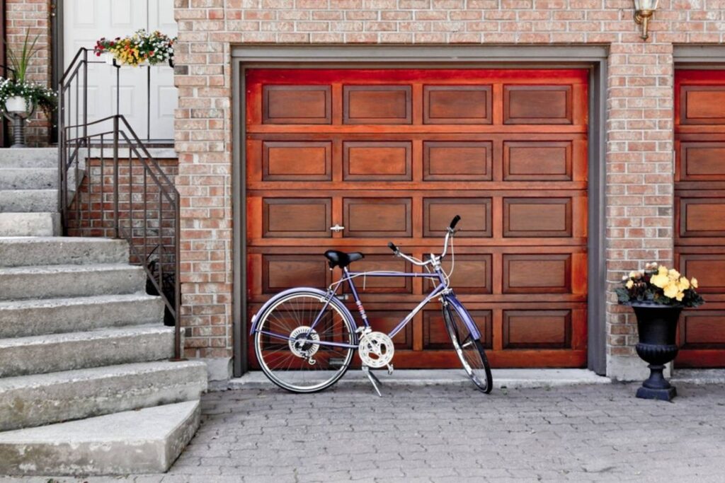 bicycle parked outside a home garage