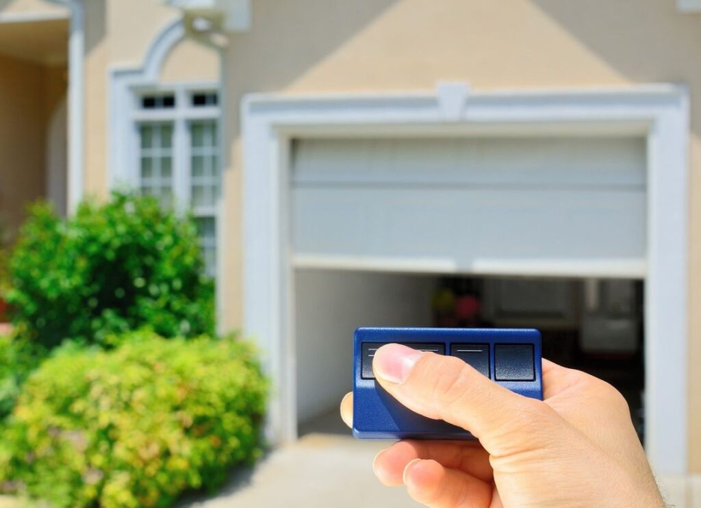 hand opening garage door with a remote