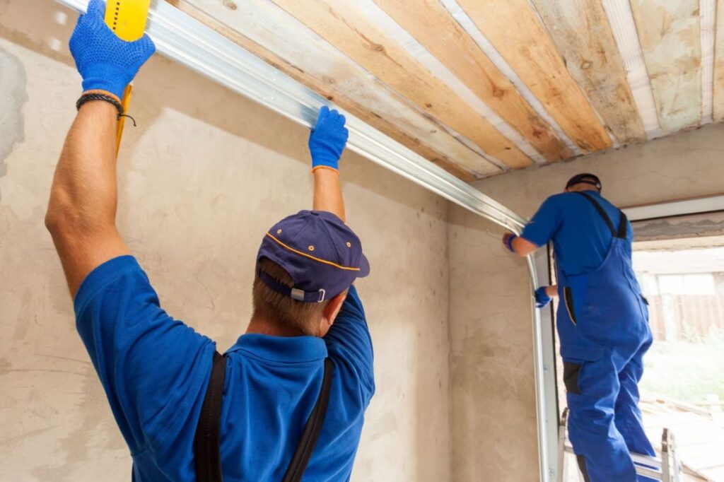 two workers constructing a garage